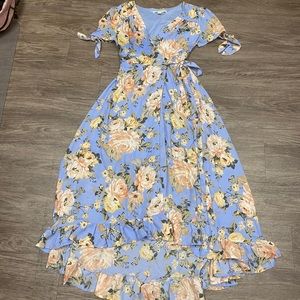 Pastel blue dress with tan and pink floral designs.